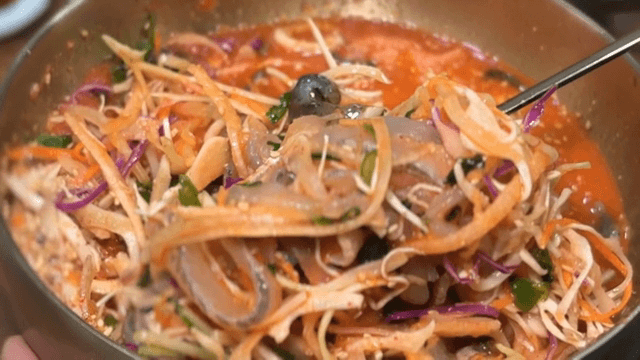 Person enjoying Cold Raw Fish Soup
