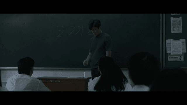 Teacher giving lesson to students in classroom