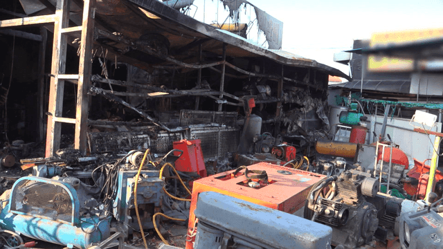 Damaged industrial site with machinery burned down