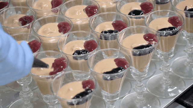 Desserts being prepared with toppings