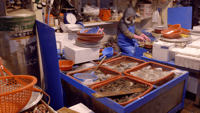 Fish preparation merchant in market