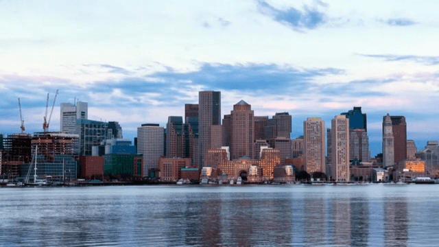 City skyline reflecting on calm water