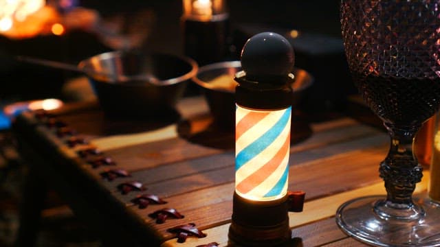 Hand adjusting a small mood light that is lit on the table