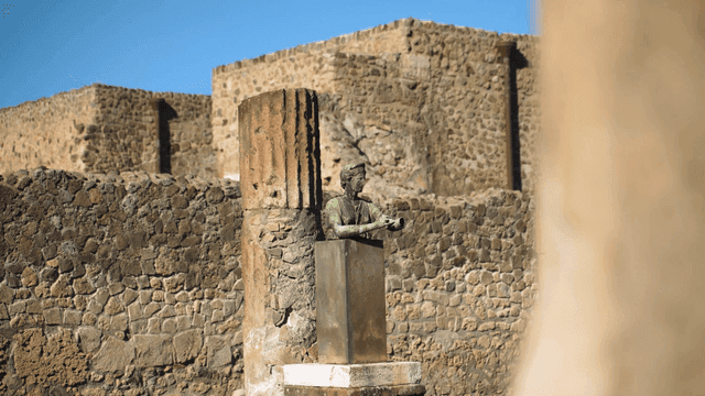 Ancient statue amidst stone ruins