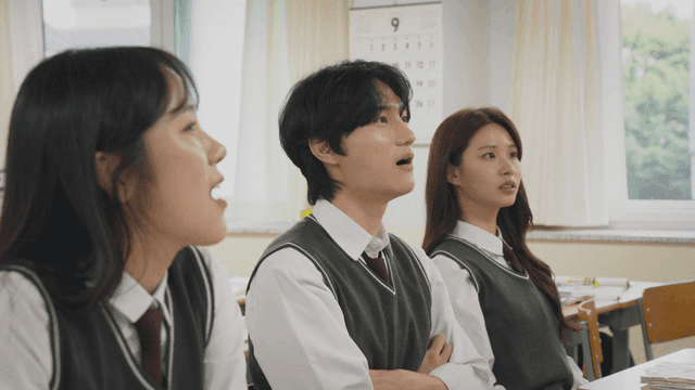 Students attentively listening in class