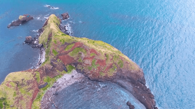 Aerial view of a rocky island and harbor
