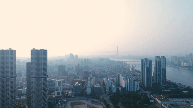 Seoul cityscape with tall buildings beside Han River