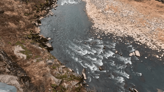 View from a bridge overlooking a flowing river