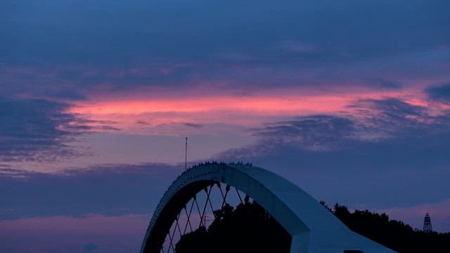 Sunset Sky Behind the Structure of Bridge