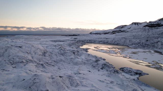 Snow-covered landscape with a serene lake