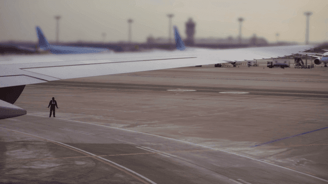 Air traffic controllers providing guidance on airport runway