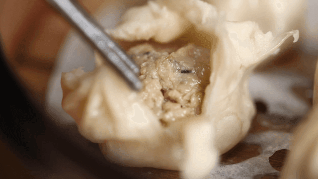 Dumplings torn with chopsticks