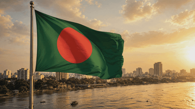 Bangladeshi flag in city at sunset