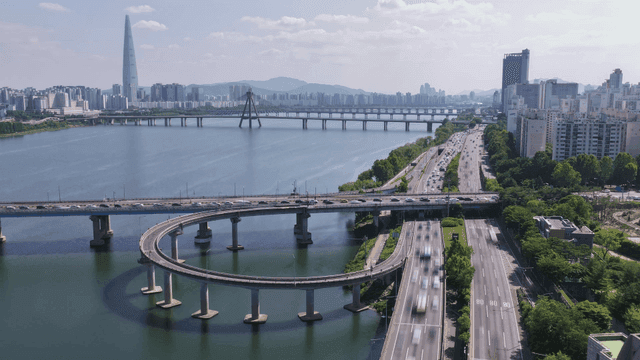 Bustling city with river and bridge