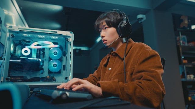 A Young Adult Engrossed in PC Gaming