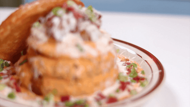 Delicious burgers with toppings on plates