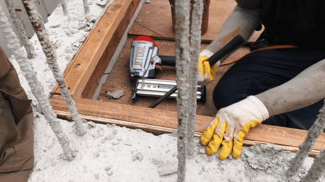 Worker using tools at a construction site