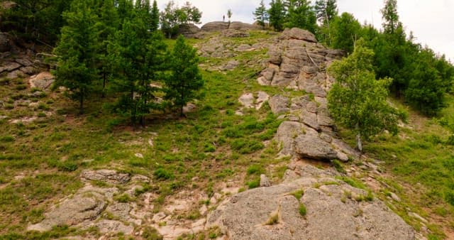 Landscape of rocky mountains with greenery