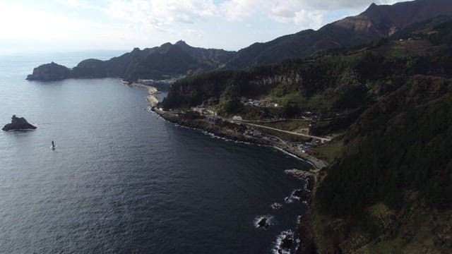 Aerial View of Coastal Village and Landscape with Open Space