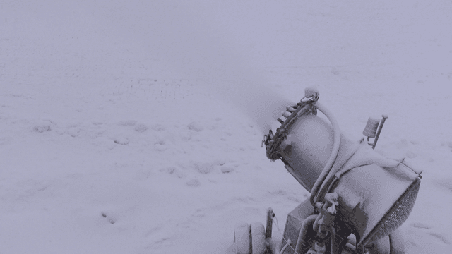 Snowmaker operating in snow-covered field