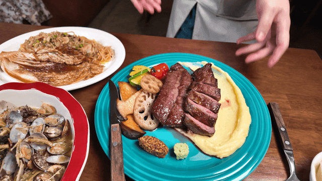 Chef showcasing steak dishes