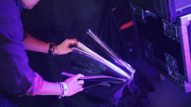DJ Selecting Vinyl of Songs to Play in the Club