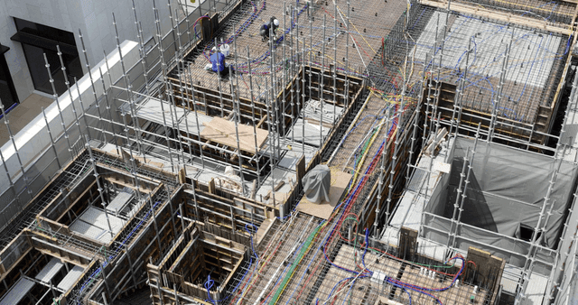 Construction site with scaffolding and cables
