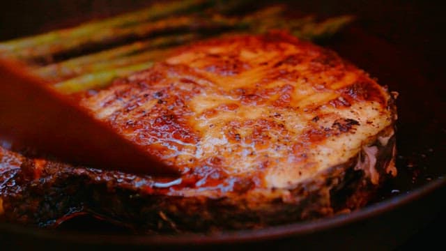 Fish steaks grilled in a hot oiled pan