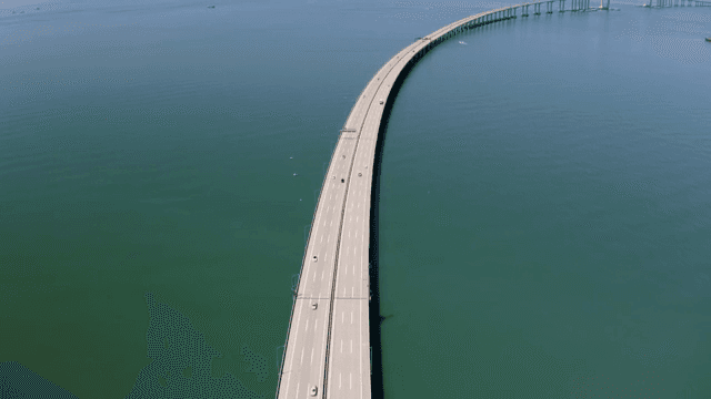 Long bridge stretching over calm sea