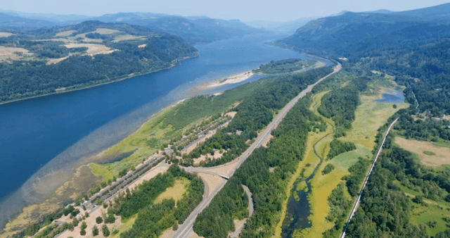 A scenic river winding through lush hills