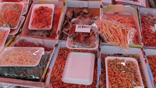 Various dried seafood at a market stall