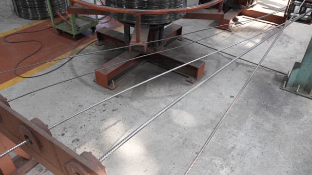 Metal wire being processed in a factory