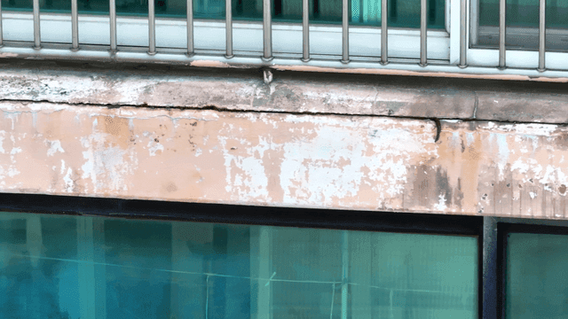 Old building facade with peeling paint