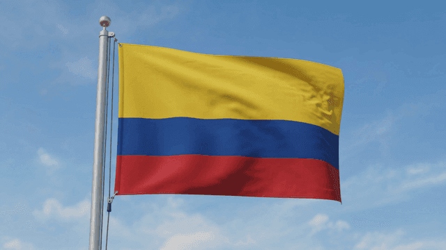 Colombian flag fluttering against clear sky