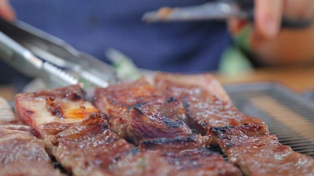 Grilled Pork Ribs Sizzling on a Grill