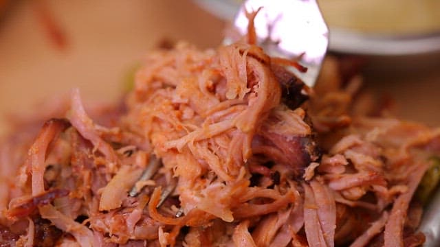 Tender pulled pork on a fork