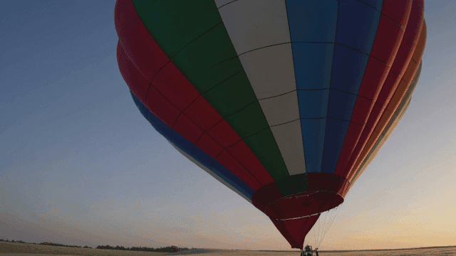 Colorful hot air balloons at sunrise