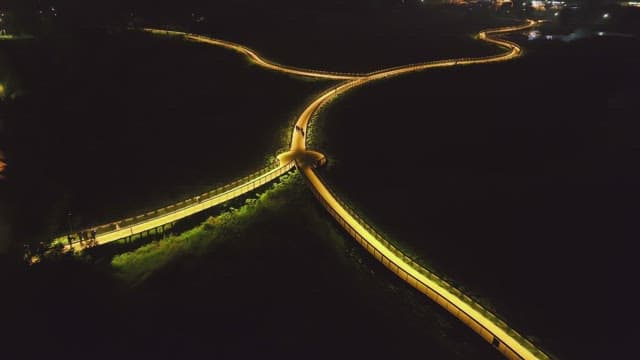 Night view of a winding illuminated walkway