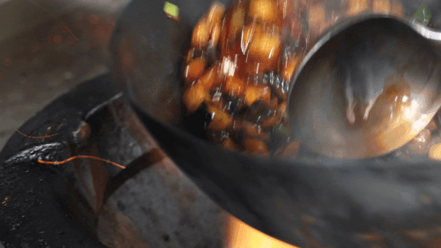 Vegetables stir-fried in hot wok
