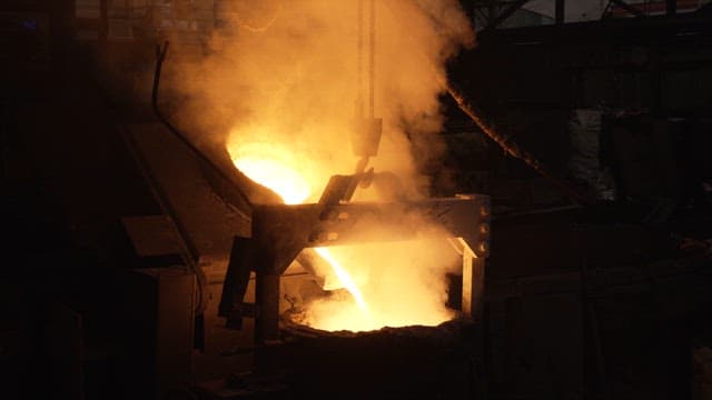 Molten metal being poured in a foundry