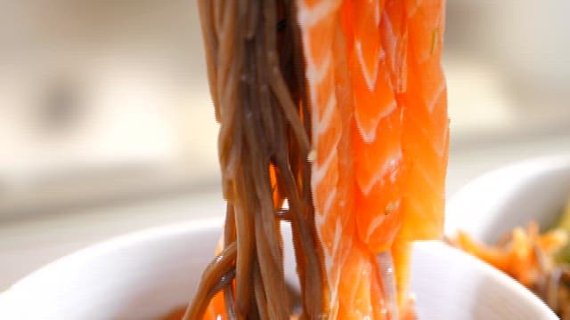 Appetizing salmon and buckwheat noodles in a bowl