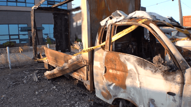 Burnt vehicle in a parking lot