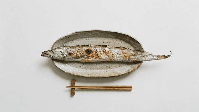 Chopsticks and long grilled cutlassfish