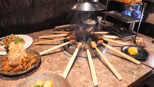Primitive skewers over brazier for roasting