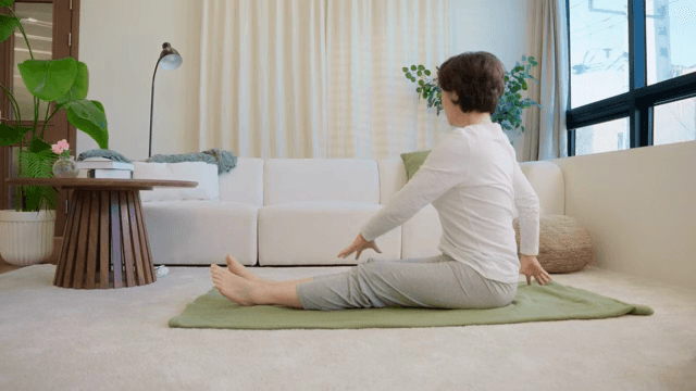 Woman stretching in a cozy living room