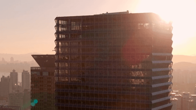 Modern skyscraper at sunset in the city