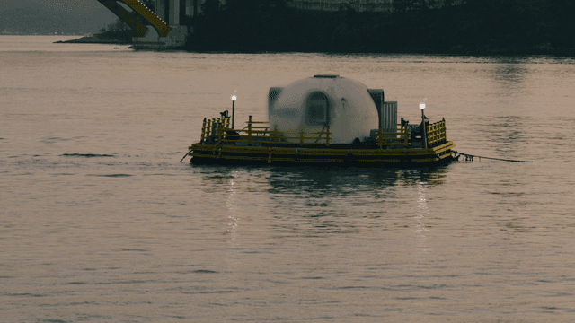 Floating pension on calm sea at night