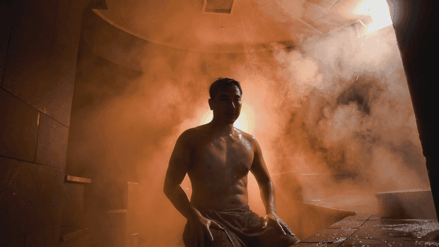 Man relaxing in steam sauna