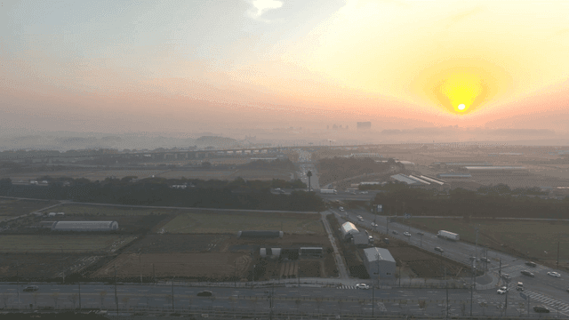 Sunrise over a rural landscape with roads