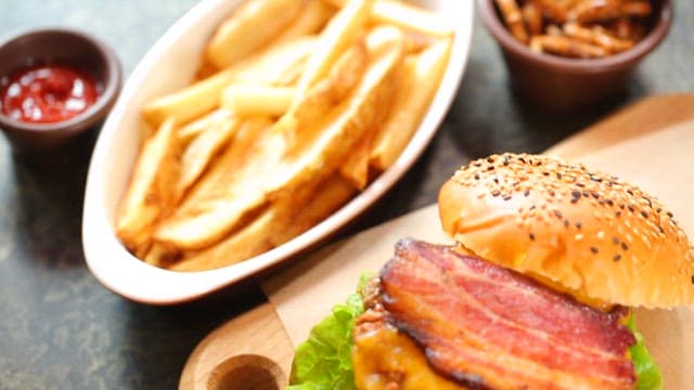 Juicy bacon cheeseburger with fries